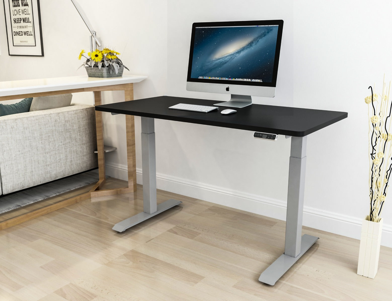 A desk with a black top and grey frame