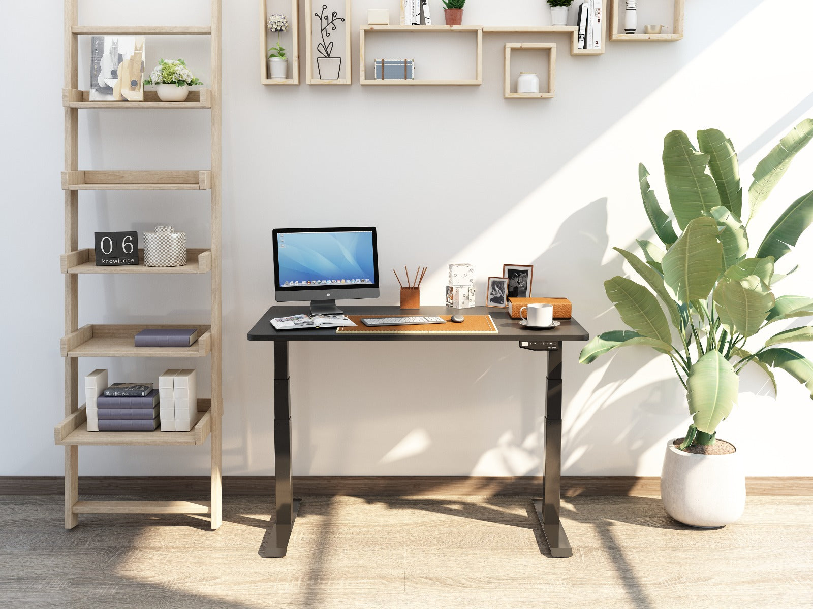 A black adjustable desk at home