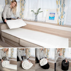 A woman folding up the travel mattress topper